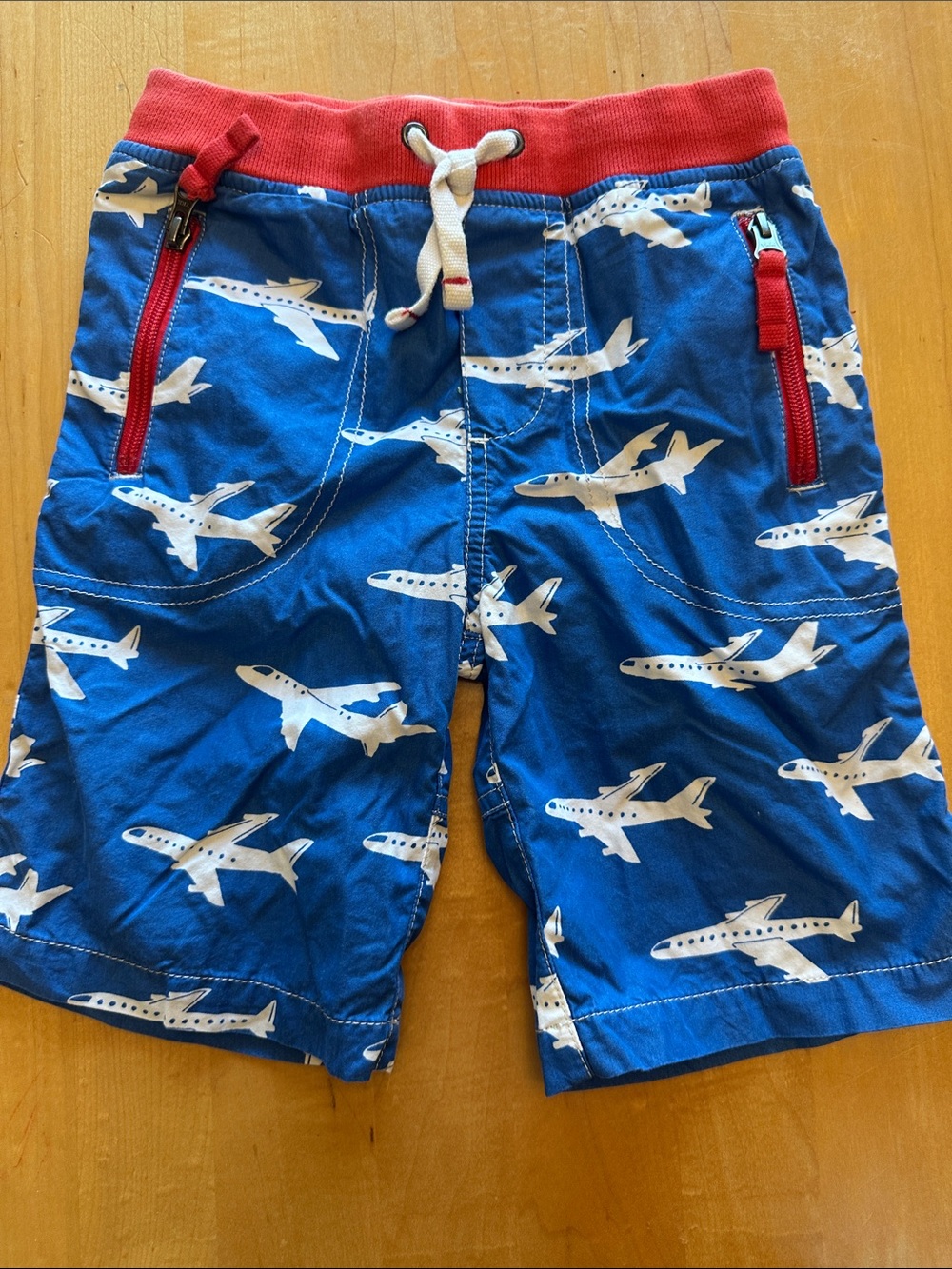 Mini Boden Blue Airplane Print Shorts with Red Waistband